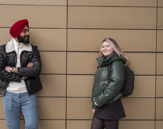 male and female students chatting outside