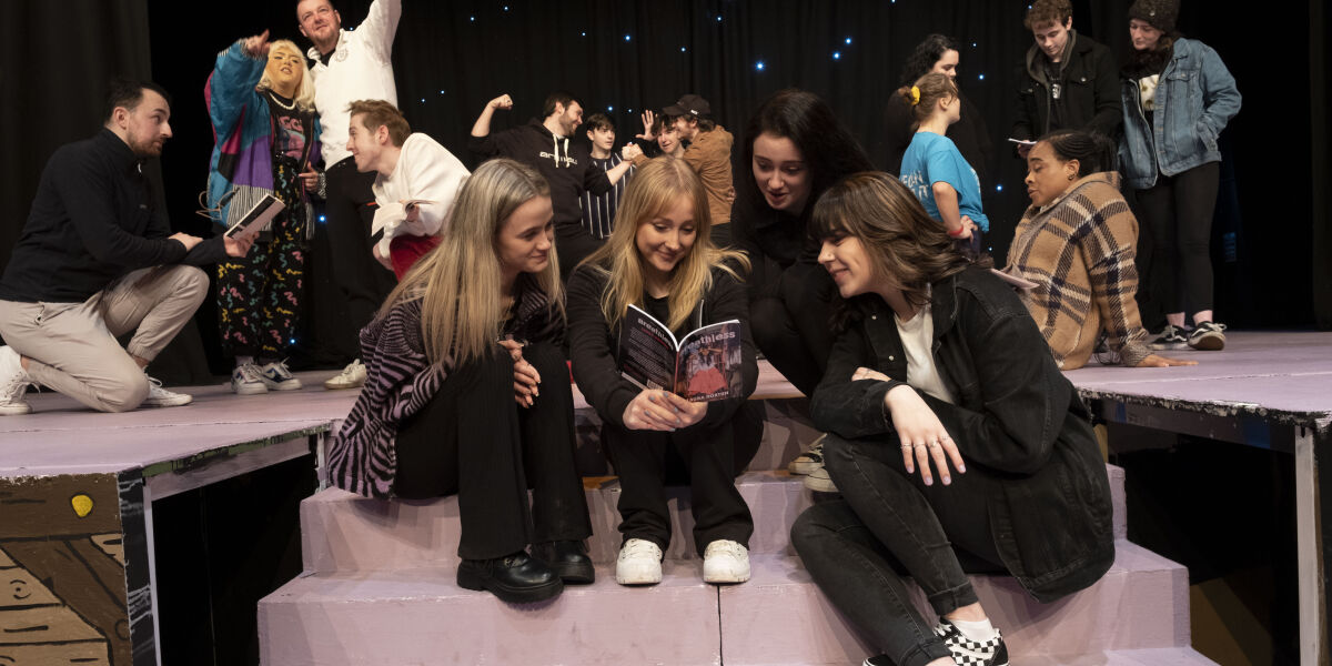 Glasgow Clyde College Acting and Performance students on stage in the Langside Theatre.