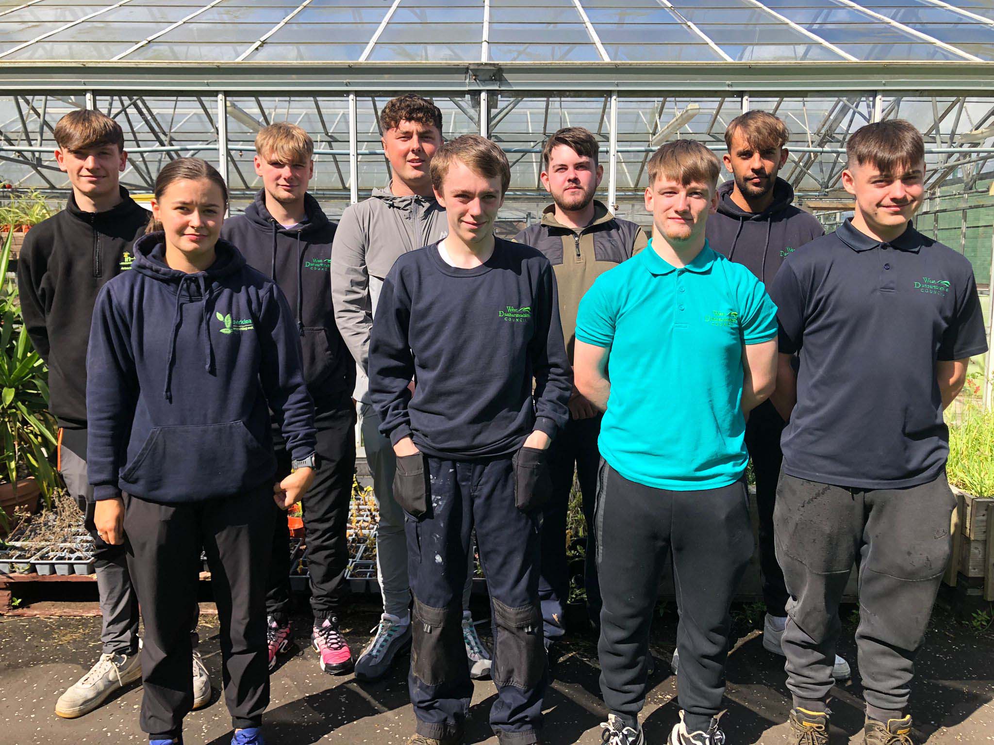 A group of horticulture apprentices at our Langside Campus, pictured outside the greenhouse.