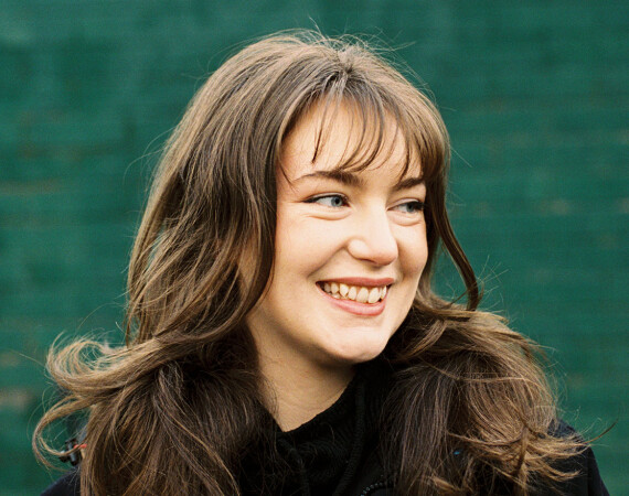 Female student in Langside Campus grounds